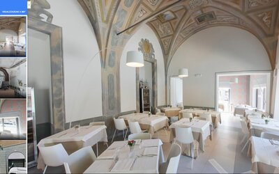 Sala interna di Le Goût con tavoli in legno e illuminazione soffusa